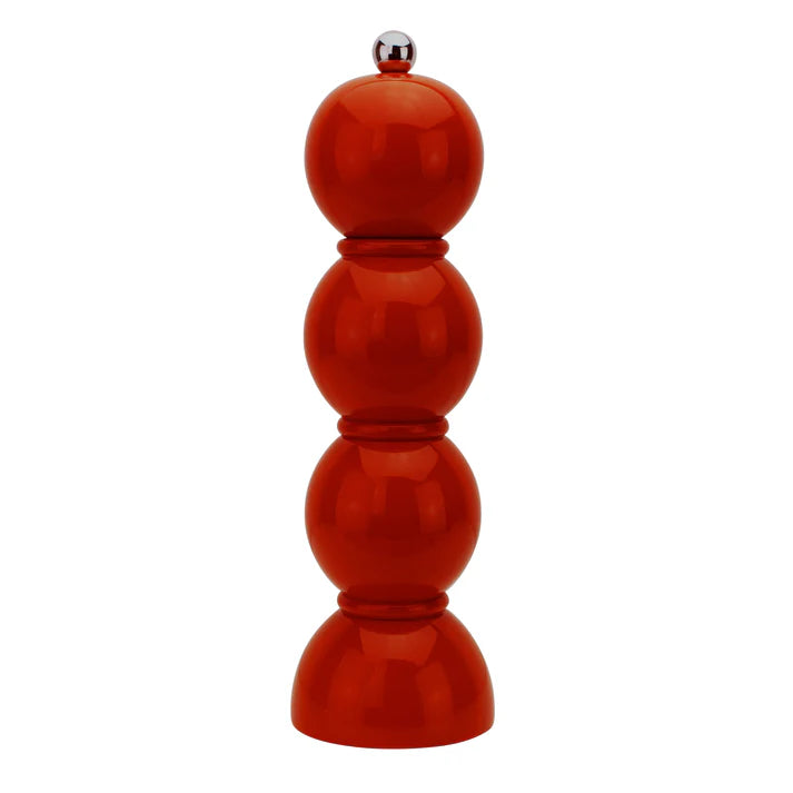 A red lacquered bobbin salt or pepper mill with a chic silhouette, featuring stainless steel screw knobs at the top.