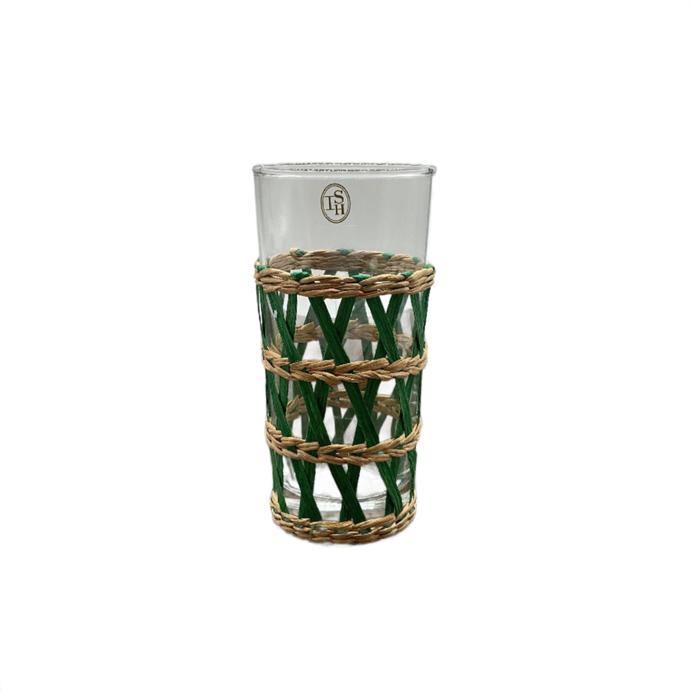 A clear highball glass with green woven seagrass wrapping