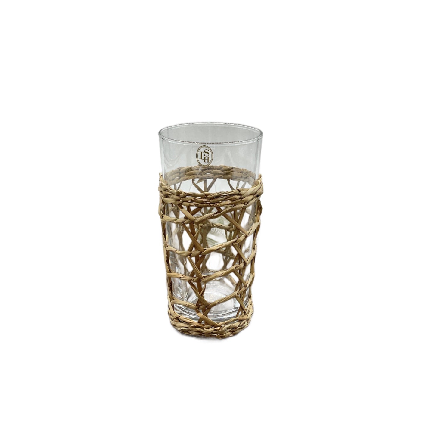A clear highball glass with a natural woven seagrass wrapping.