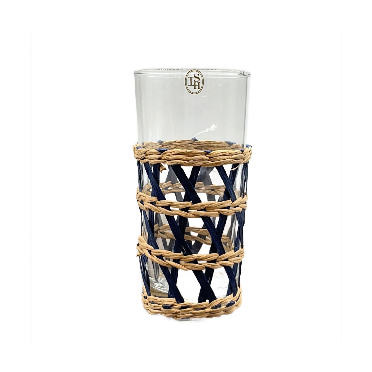A blue highball glass with clear glass upper part and blue woven seagrass lower part