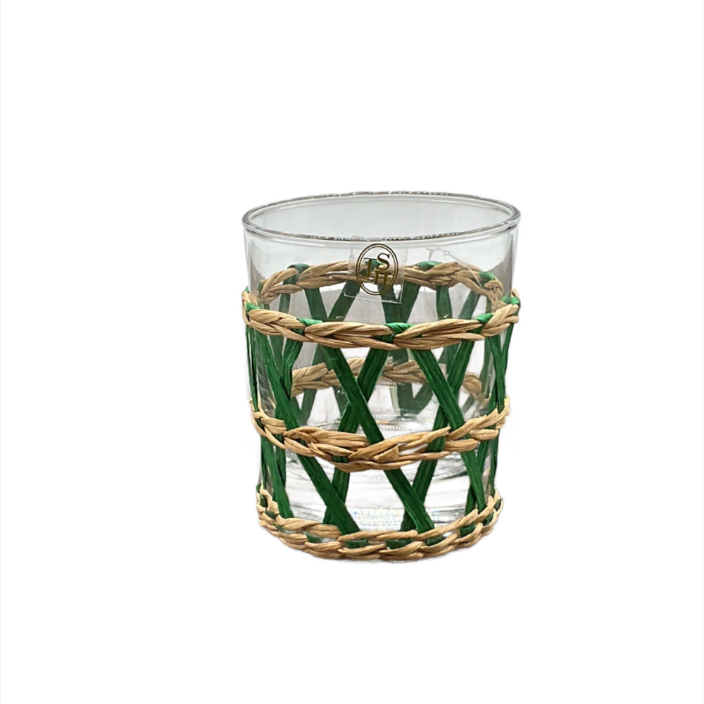 A clear highball glass with a green woven seagrass wrap