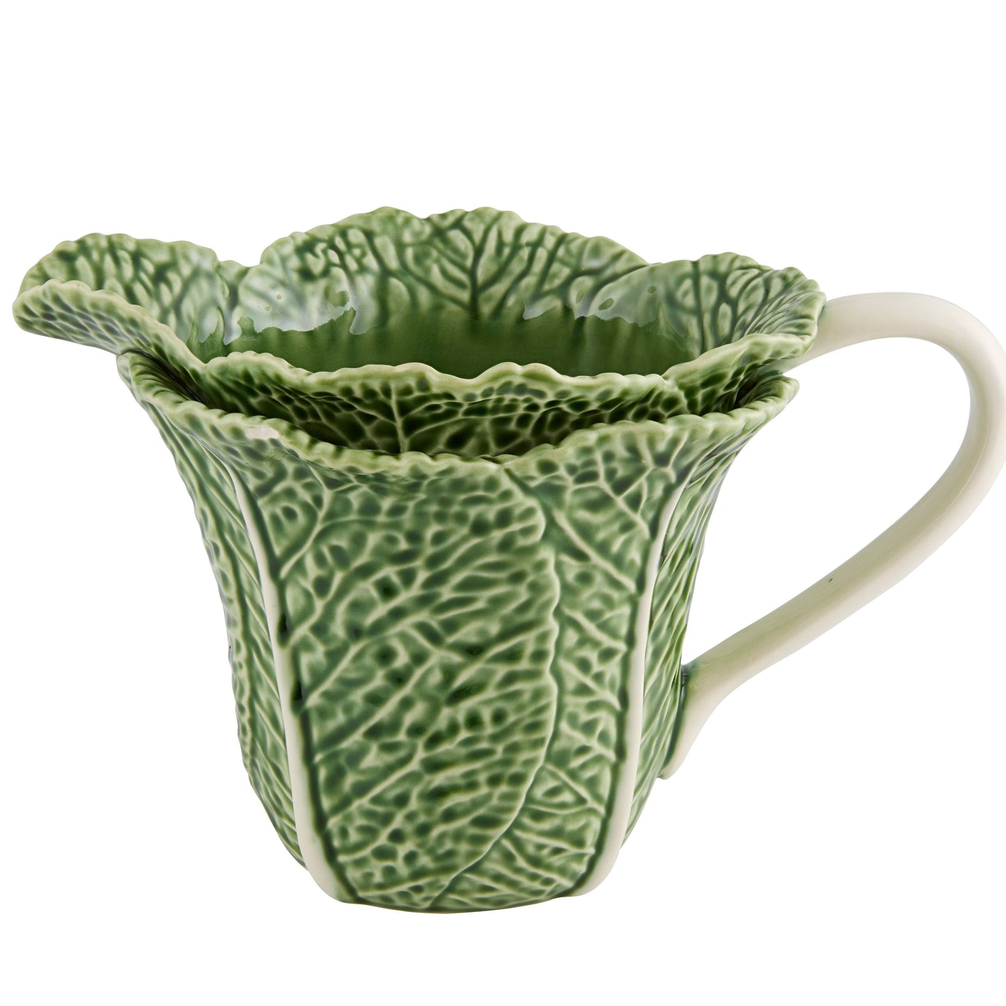 A green ceramic pitcher with a leaf-like pattern, inspired by the cabbage leaf, with a white handle.