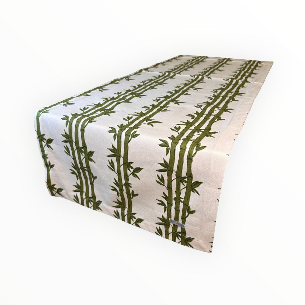 
                      
                        Table runner with green bamboo pattern on a white background
                      
                    