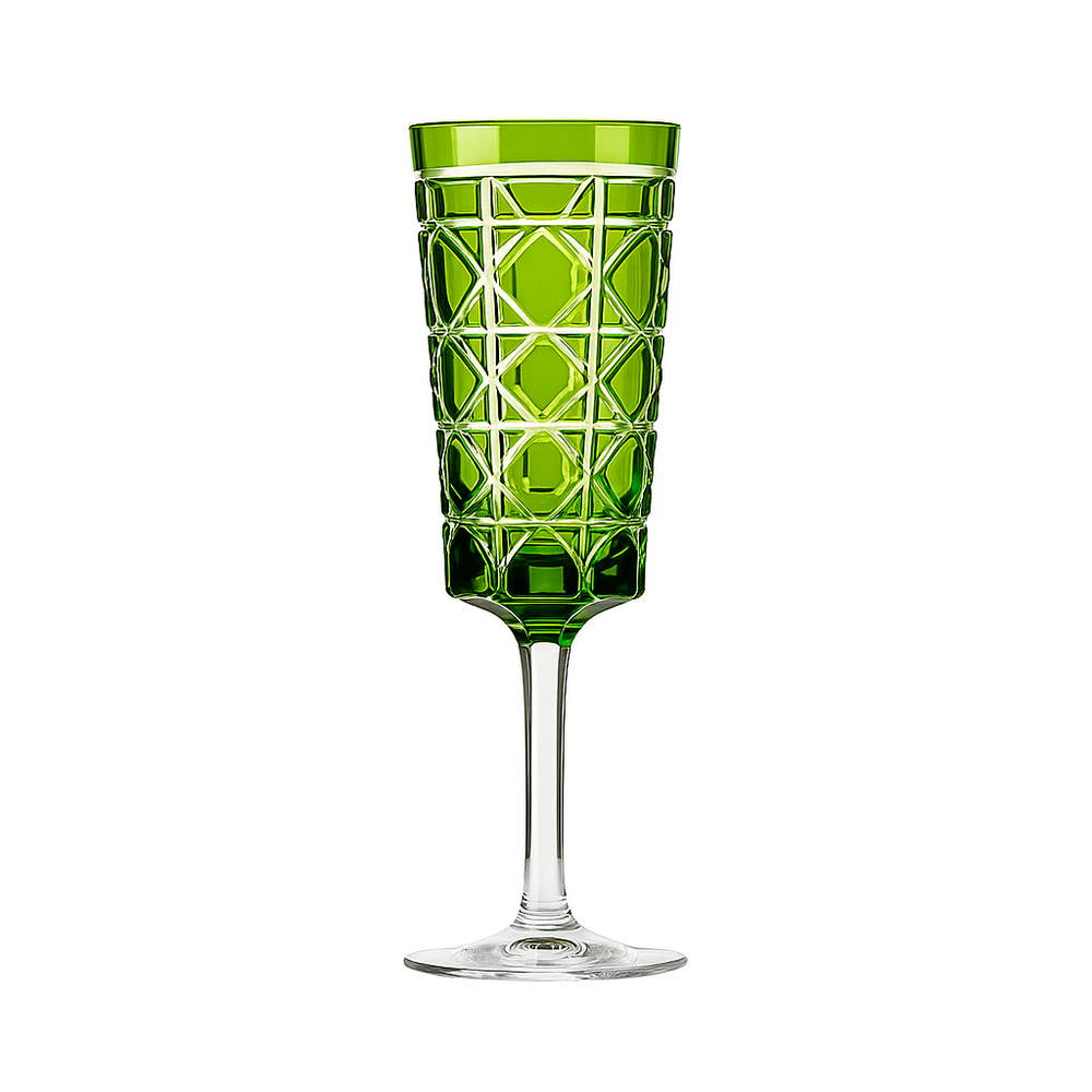 A green engraved royal crystal champagne glass with a geometric pattern.