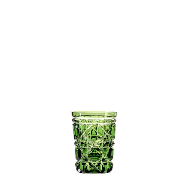 A green engraved royal crystal shot glass with a geometric pattern.