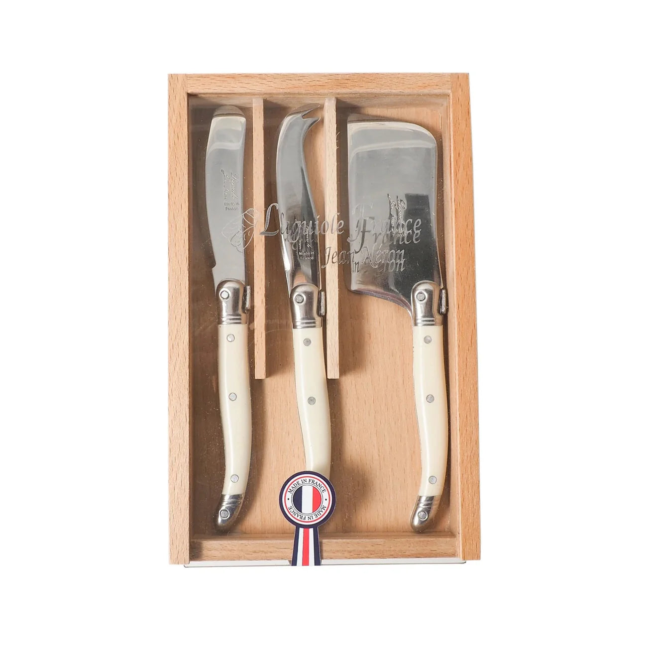 A 3-piece Laguiole cheese set with ivory-colored handles, displayed in a wooden box with a French flag color detail.