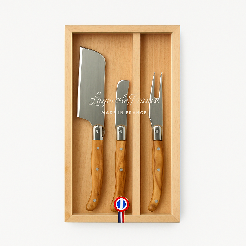 A 3-piece Laguiole cheese knife set with olivewood handles, presented in a wooden box with a clear acrylic lid.