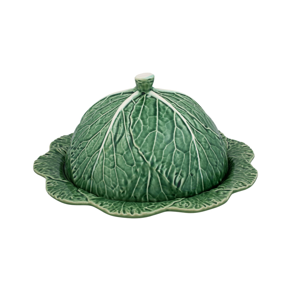A green ceramic cheese tray designed to resemble a cabbage leaf with a dome-shaped lid, part of the Bordallo Pinheiro Cabbage Collection.