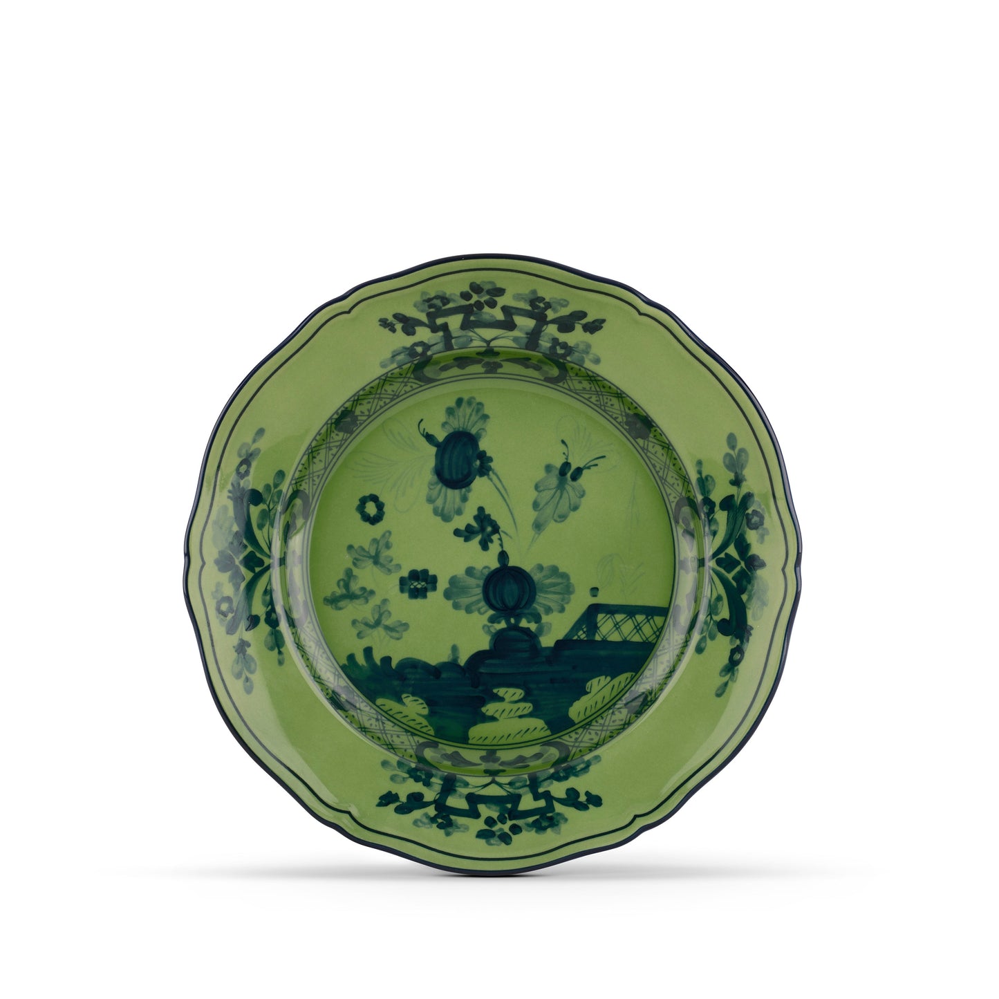 A green porcelain dessert plate with floral patterns and a malachite design, from the Oriente Italiano collection.