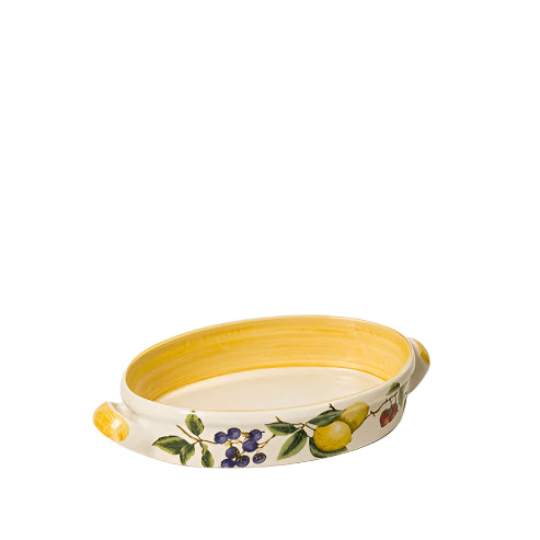 An oval-shaped ceramic serving dish with handles, featuring a floral pattern in muted colors on a beige background with a yellow interior.