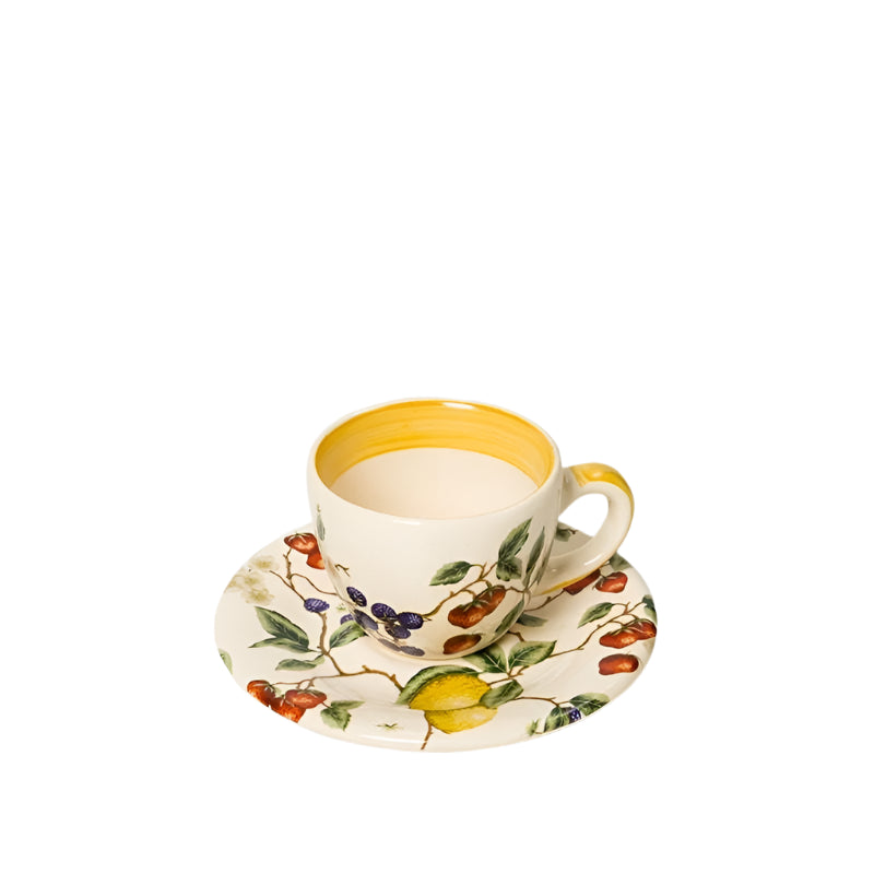 tea cup with yellow trim and floral patterns, accompanied by a matching saucer.