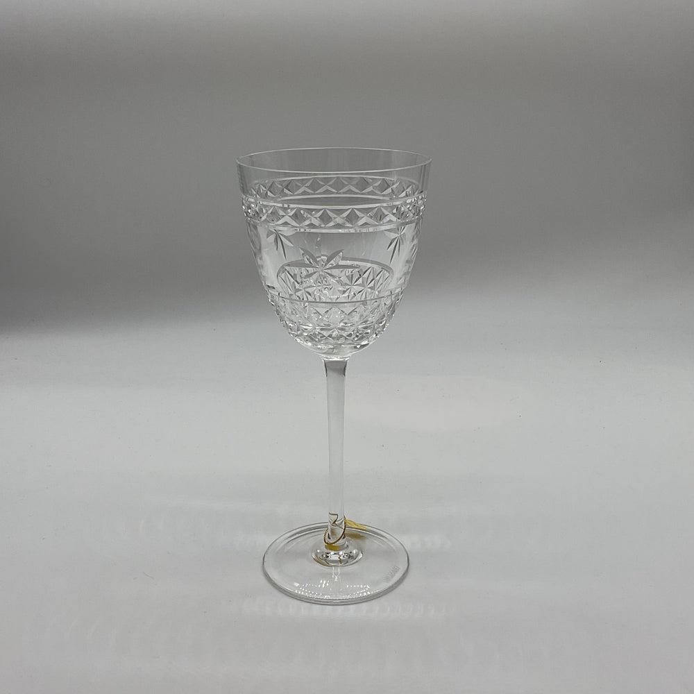 A clear crystal red wine glass with a geometric pattern.