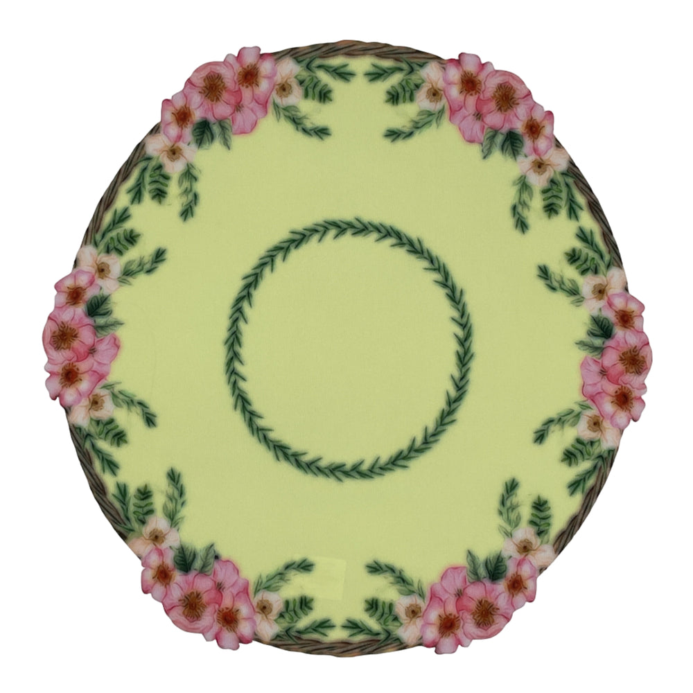 Decorative plate with floral design on a plain background