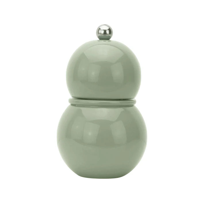 A solid sage green Chubbie salt or pepper mill with a bobbin shape and a metallic knob on top.