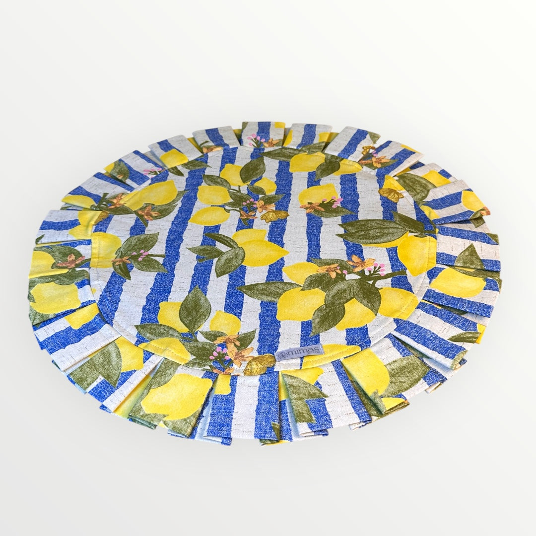Round table mat with lemon and blue striped pattern on a white background