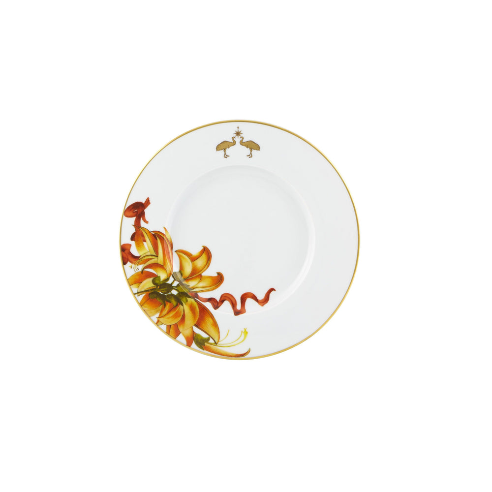 A white dessert plate with a gold border and a floral design in the center, featuring a gold bird illustration.