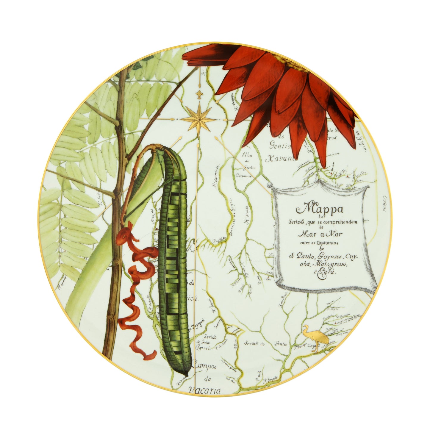 A decorative charger plate featuring a central floral and map design with gold accents, and an illustration of a green fruit or vegetable.